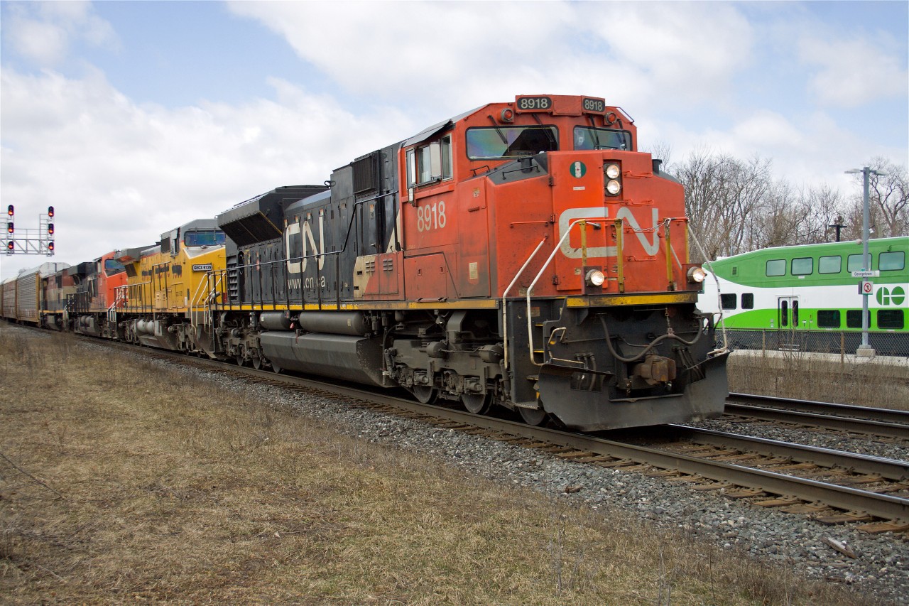 422 has an interesting mix of leased and home road power this morning as it rolls past the VIA station in Georgetown--CN SD70M2 8938, GECX C40-8W 9129, CN ES44DC 2339, and BCOL dash 8-40CMu 4604.