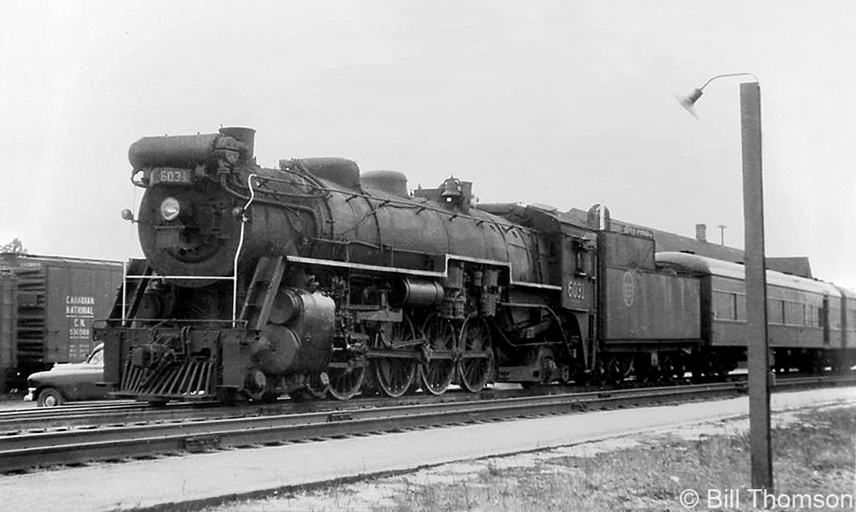 CN 4-8-2 "Mountain" 6031 (U1b class, built by CLC in 1924) works early evening passenger train #18, shown at Port Credit station at 7:45pm in 1957.