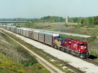 Back in those heady days of continuous leasing by the major roads; a typical CP train shown here Buffalo-bound has a pair behind the leader. Consist is CP 5606, HLCX 6054 and HATX 216. The train has just exited the Welland canal tunnel, running eastward. I am shooting from the overhead CN Stamford Sub bridge on a beautiful fall day.