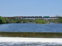 Delaware & Hudson GP38-2 7303 leads the weed sprayer train Eastbound across the Grand River at a blistering pace of 10MPH