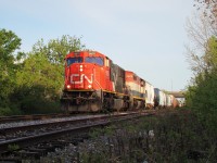 CN 5670 and BCOL 4623 lead a 50 car 438 under the E.C. Row Expy and out of Windsor as they head up the Pelton spur, former C&O Sub. 1 at Walkerville Jct.