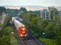During the summer of 2014, CP 6249 and CP 6256 lead the westbound Expressway past the advance station sign for Valois. This piggyback service between Toronto and Montreal will run its last revenue run this week.
