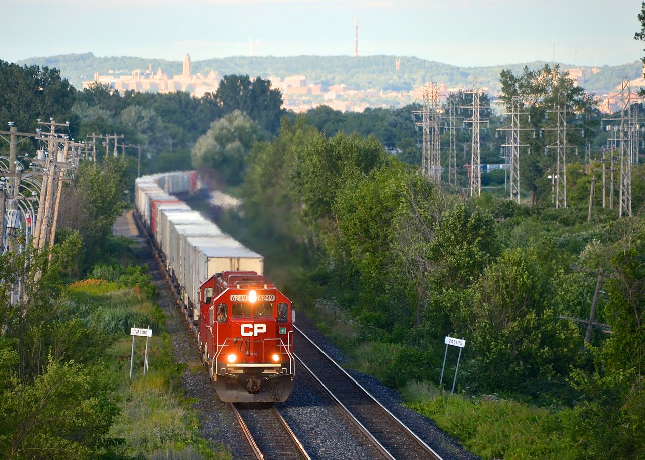 During the summer of 2014, CP 6249 and CP 6256 lead the westbound Expressway past the advance station sign for Valois. This piggyback service between Toronto and Montreal will run its last revenue run this week.