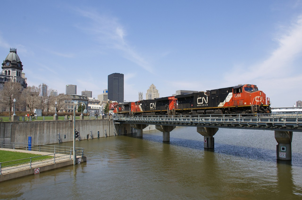 A late 149 is crossing the Lachine Canal a bit after noon with CN 2295, CN 2283 & CN 8013 for power as it exits the Port of Montreal with intermodal traffic for Toronto and Chicago.