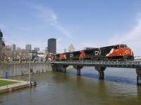 A late 149 is crossing the Lachine Canal a bit after noon with CN 2295, CN 2283 & CN 8013 for power as it exits the Port of Montreal with intermodal traffic for Toronto and Chicago.