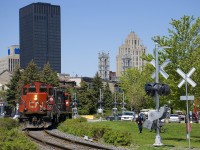 After bringing some cars into the Port of Montreal, the Pointe St-Charles switcher is leaving the port light with GP9's CN 4135 & CN 7226. Crossing gates (not yet completed and i use) will soon protect the numerous crossings in the area.