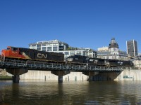 CN 149 has CN 5663, NS 9012, NS 3623 and 13,000 feet of intermodal traffic for Toronto and Chicago as it leaves the Port of Montreal on a gorgeous morning.