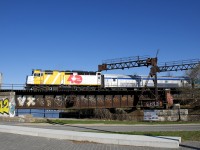 Wrapped VIA 6437 leads VIA 64 over the Lachine Canal five minutes before it reaches its terminus of Central Station in Montreal.