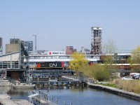 GP9's CN 7226 & CN 4135 lead a short transfer into the Port of Montreal as they cross the eastern entrance to the Lachine Canal, with the easternmost lock in the foreground.