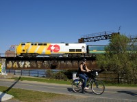 VIA 907 pushes VIA 37 over the Lachine Canal bike path and the canal itself. After changing directions it will head towards its terminus of Fallowfield, Ontario.
