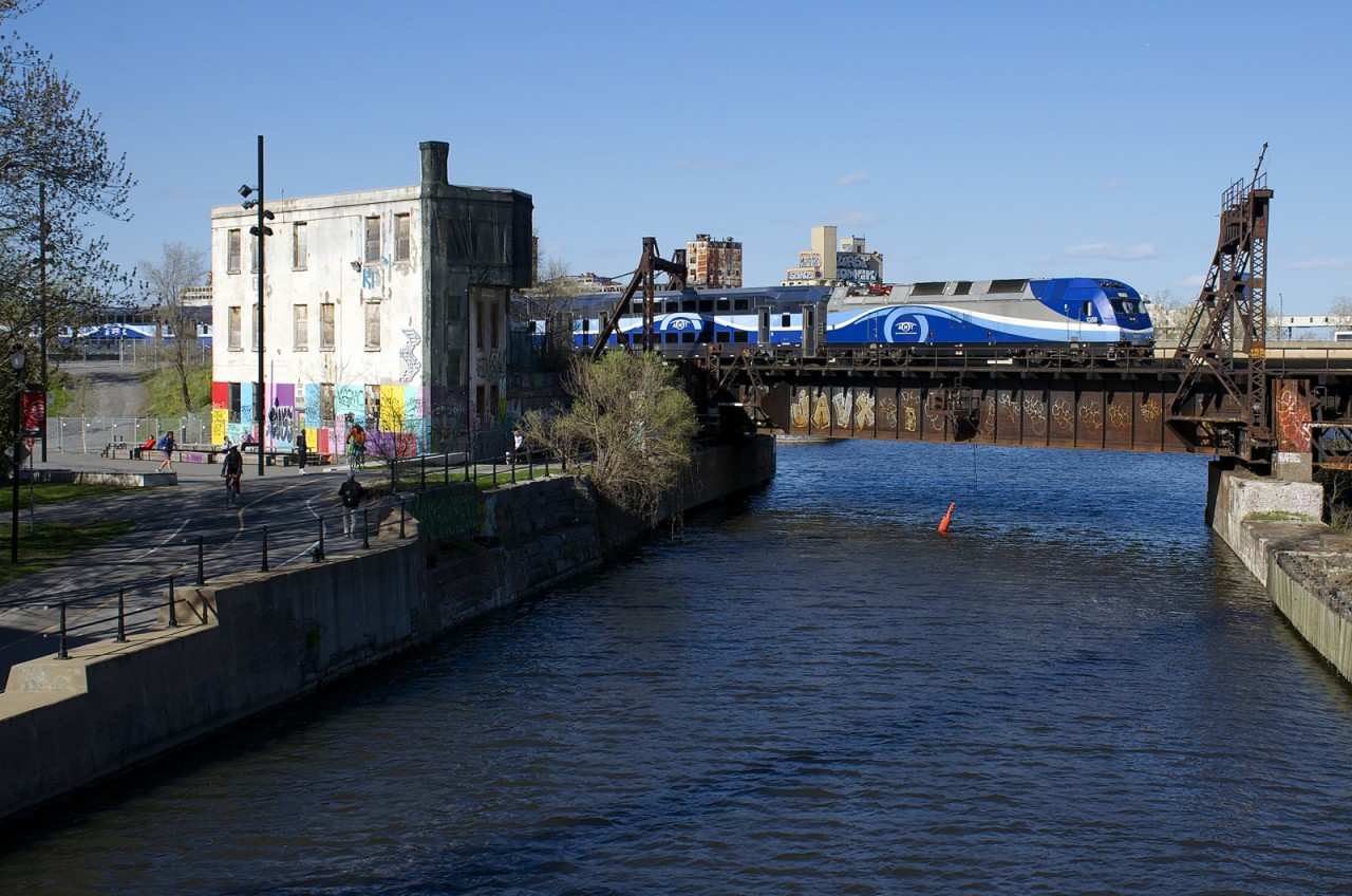 AMT 1359 leads the 1650 departure from Montreal's Central Station for Mont-Saint-Hilaire over the Lachine Canal.