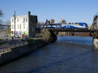 AMT 1359 leads the 1650 departure from Montreal's Central Station for Mont-Saint-Hilaire over the Lachine Canal.