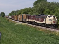 A pair of classy looking OSR units lead the Woodstock Job as they approach the diamond with CN at Carew.