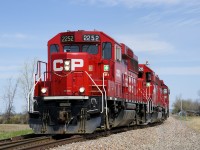 CP F94 with CP 2252, CP 4428 & CP 3024 is leaving the St-Mathieu siding after dropping off cars for Lafarge there, on its way to servicing customers in Napierville.