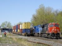 With CN 149's tail end at left (the train is stopped due to engine issues), potash train CN B730 changes crews at Turcot West before heading east, with CN 3055 & CEFX 1011 up front 