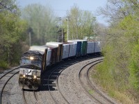 NS 9566 only has one numberboard as it leads CN 529 around a curve on CN's Montreal Sub, on its way to Rouses Point, NY. Trailing is NS 4143