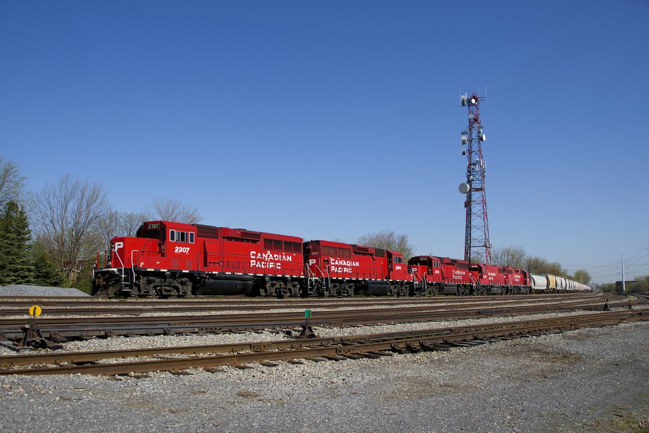 CP F94 has five geeps (CP 2307, CP 2280, CP 2252, CP 4428 & CP 30324) with cars for the Lacolle Sub as it passes Lasalle Yard. Two of the geeps will be set off at Delson.