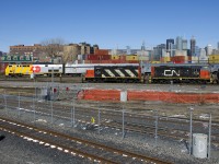Wrapped for VIA Rail's 40th anniversary, VIA 914 leads VIA 65 past the Pointe St-Charles Yard, including a pair of GP9's working the yard (CN 4135 & CN 7226).