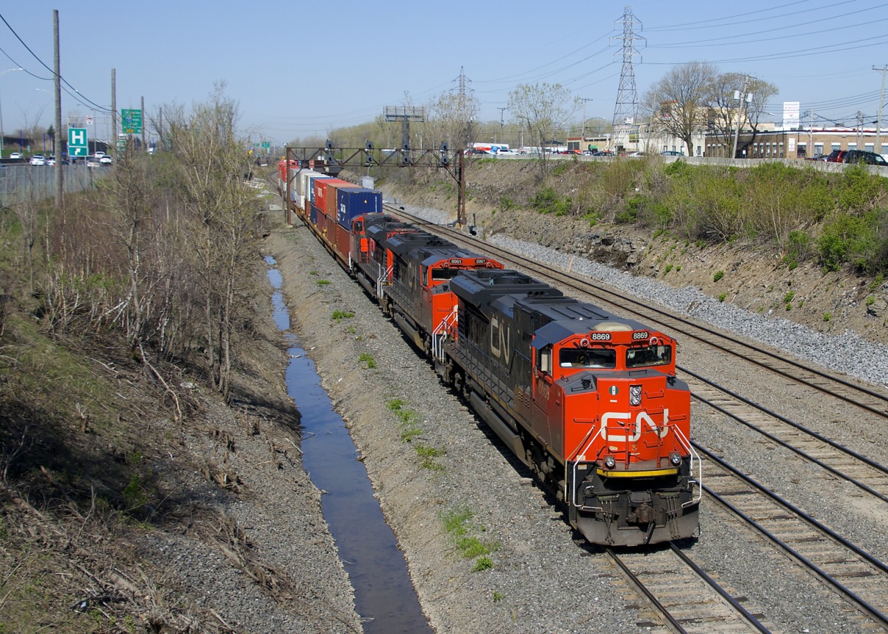 A trio of SD70M-2's (CN 8869, CN 8961 & CN 8834) leads CN 120 out of Taschereau Yard, bound for Halifax.