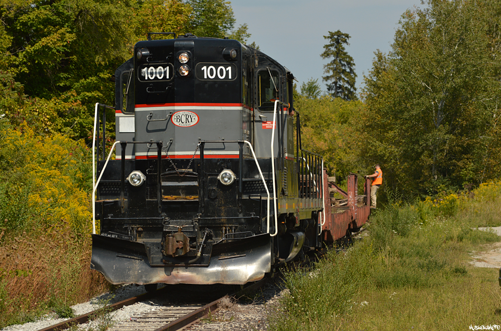 CCGX (BCRY) 1001 shoves 2 flats loaded with rail and an end of track bumper from the Molson spur out the South end of the Big Bay Point spur, shortly they'll hop on the former CN Midland sub engine first for the runaround at Innisville.