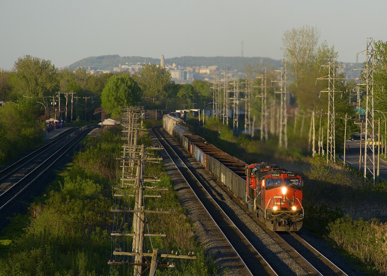 CP 2544 and an unidentified SD70M-2 lead CN 309 through Pointe-Claire during some nice evening light.