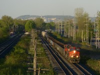CP 2544 and an unidentified SD70M-2 lead CN 309 through Pointe-Claire during some nice evening light.