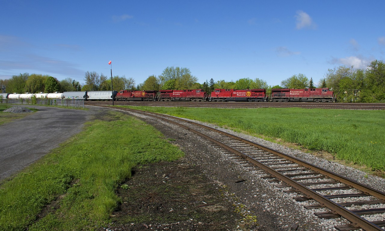 A 4-pack of GE's (CP 8835, CP 8112, CP 9357 & CP 8505) lead CP 253 past the Lasalle Yard and the southern leg of the wye leading to the Lasalle Loop Spur. It's nice to finally see some green out there.