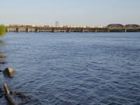 Empty grain train CP 351 has a pair of UP units off of CP 650 (UP 5537 & UP 5499) as it crosses the St. Lawrence River towards the island of Montreal a bit over an hour before sunset. This train originated in Albany, NY and is heading to Winnipeg, MB.