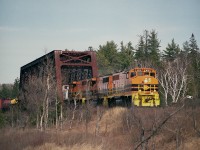 We've heard recently of the loss of considerable trackage by both the GEXR and the SOR in Ontario before the end of the year 2018, but also the G&W is threatening once again to shut down the Huron Central Railway before the end of the year. Money badly needed via the government so far has not been put on the table, and without $46.2M over 5 years the railroad cannot undertake badly needed track maintenance. So it is a wait and see what happens situation for the time being. The line is in rough shape. It was leased from CP back in 1997 and sufficient money to keep the road up to snuff has not materialized. Adding to the problem is declining tonnage over the 283KM track from SOO to Sudbury. Main customers are Essar Steel (Algoma) out of the SOO, and forest products from Domtar (Espanola) and Eacom (Nairn Centre). Shipping of 13,000 carloads a year all told apparently is not enough to keep the line economically viable. Pictured is a typical daily train (one each way) westbound crossing the Spanish River, roughly between McKerrow and Nairn Centre. Power is HCRY 3012, 3010 and 3011.