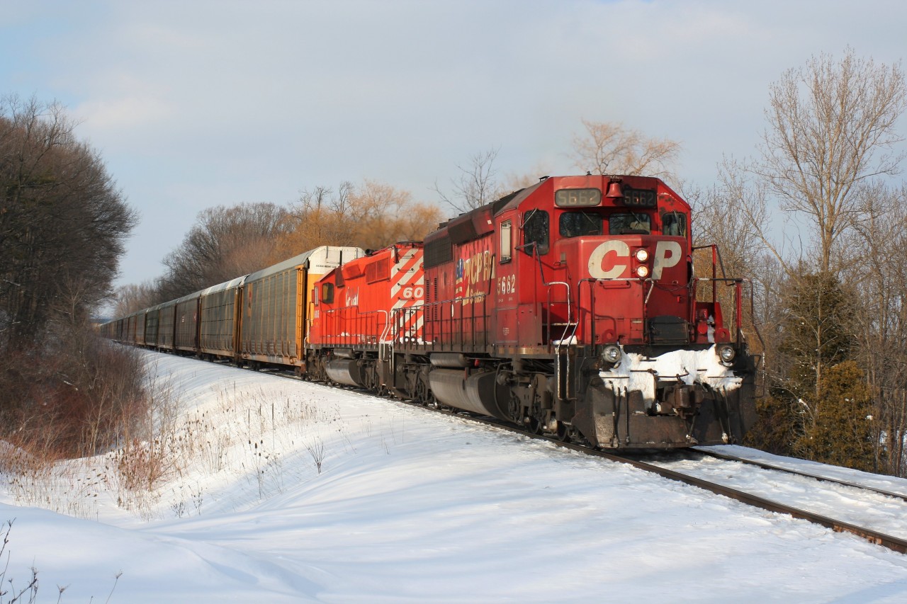 Wearing a slowing fading duel flags paint scheme, Canadian Pacific SD40-2 5662 leads a westbound train up the ironic Orrs Lake hill, west of Galt, Ontario on the railway’s namesake Galt Subdivision.