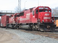 An eastbound Canadian Pacific train is switching the Quebec Street yard in London, Ontario with SOO Line SD60 6045 and CP SD40-2 5641. 