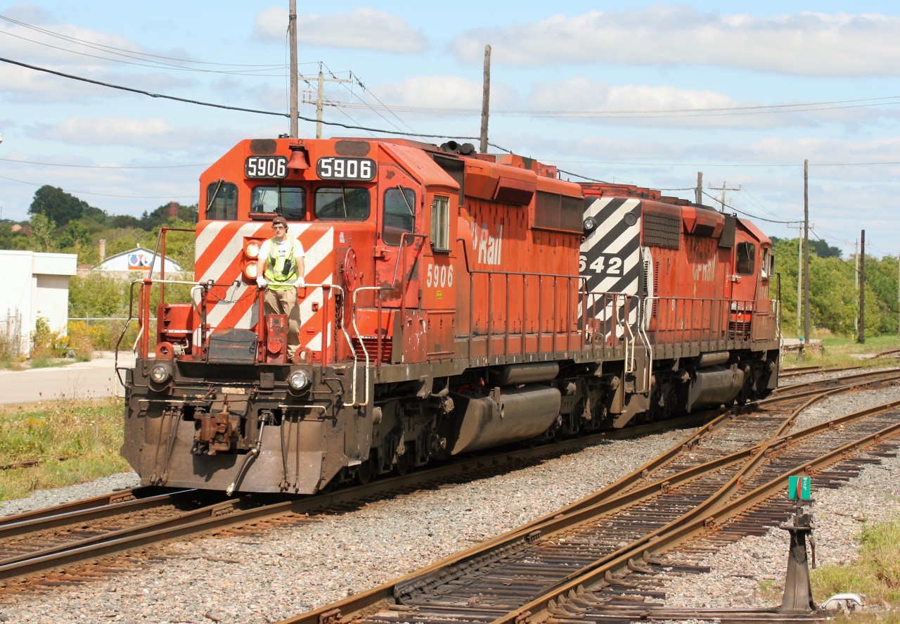Canadian Pacific SD40-2's 5642 and 5906 are seen returning to their train after setting off cars in the yard at Woodstock prior to continuing their journey east on the Galt Subdivision.