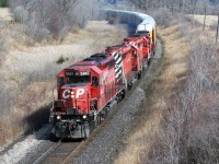A quartet of SD40-2's in various paint schemes lead a westbound Canadian Pacific train as it approaches the Highway #2 crossing just west of Woodstock on the Galt Subdivision.