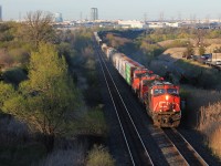 After waiting for Q148 to clear, M399 takes its turn over the single track bridge at Humber in the seemingly endless ballet of trains at this location. 