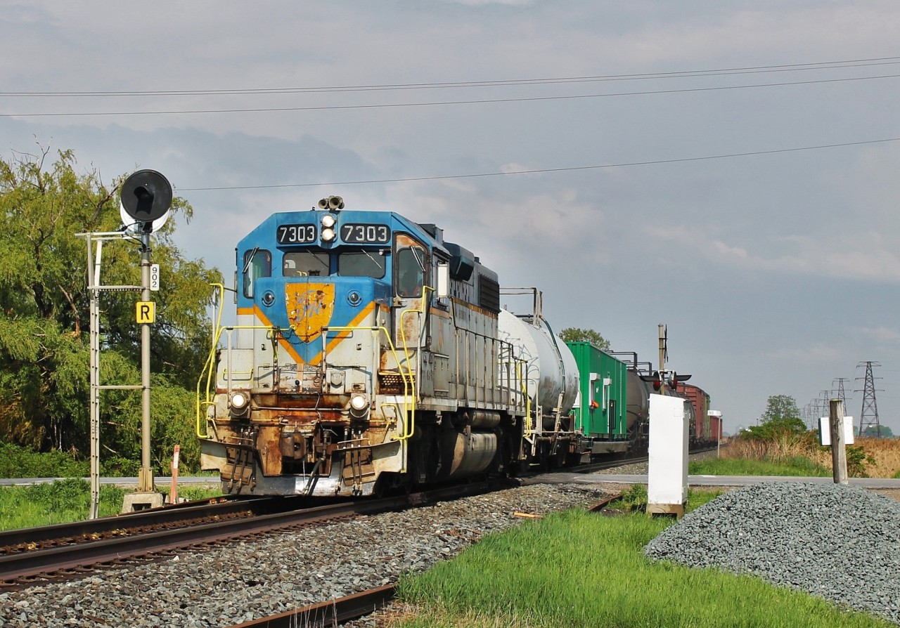 This year's spray train ran exactly a year apart from the one last year to the day down in the Windsor area. Only difference was last year was D&H 7304. Just before this shot was taken a pop-up thunderstorm came through so I got lucky that there was a bit of a break between the clouds for this shot. If only I was 20 20 years ago. I could have shot way more of these D&H units instead of just the 2 remaining in service.
