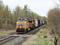 What a nice surprise this was from the faded red CP locomotives I've been seeing lately running down the Galt sub. Not only a UP leader in UP 7802 but a UP trailer in UP 8058 hauling 7800 feet of mixed manifest freight through Puslinch cleared to Ayr. Finally the dull brown of winter is giving up to the green of spring!