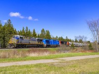 CREX 1505, CEFX 1011 and CN 3055 trailing, leads train 406, as they rumble through Passekeag, New Brunswick on a beautiful Spring time afternoon. 