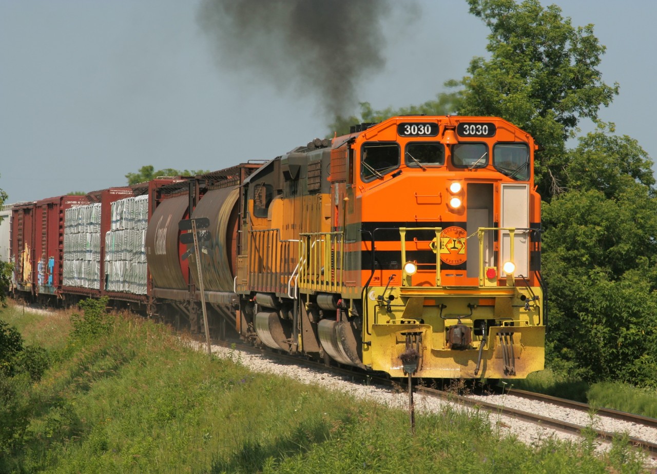Goderich-Exeter Railway (GEXR) train 518 is viewed just east of Baden, Ontario on the Guelph Subdivision with GP40-2L(W) 3030 and LLPX GP38-2 2236. The train is heading to Kitchener and eventually to the interchange with Canadian Pacific.
