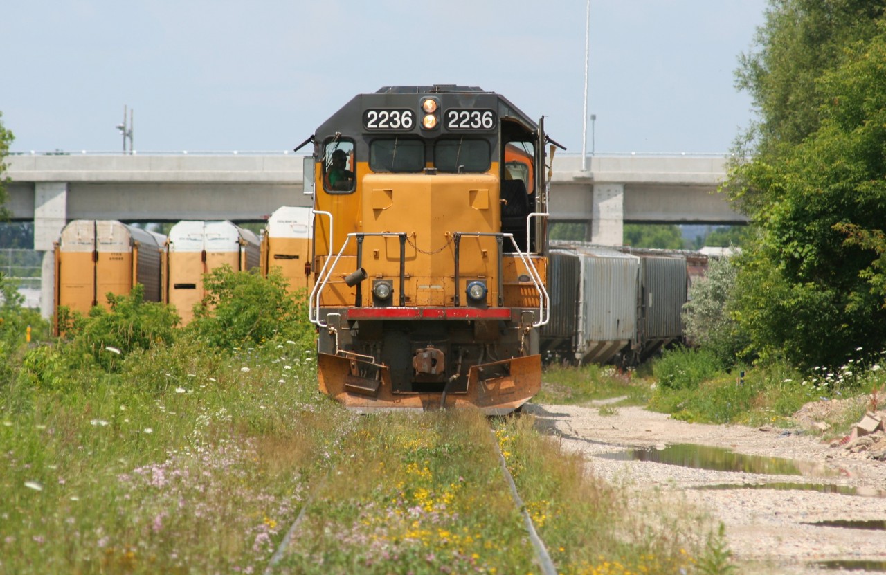 Goderich-Exeter Railway (GEXR) train 518 with LLPX GP38-2 2236 and GEXR GP40-2L(W) 3030 are hard at work switching a full interchange with Canadian Pacific at Kitchener, Ontario.