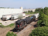 With the weeks quickly passing before Cando passes over the reigns of the OBRY to Trillium, there are a few shots along the line I still want to do justice. The shot here is off the side of Highway 401 near the old village of Meadowvale, just north of Streetsville. Unfortunately the warehouse on the short stub to the left stopped receiving rail service a couple years ago. The industry to the right though is still very active and is served by Canadian Pacific's train T14. Today the OBRY's southbound trip has several cars in tow as they head for the CP interchange in Streetsville where a number of cars await their northbound trip.