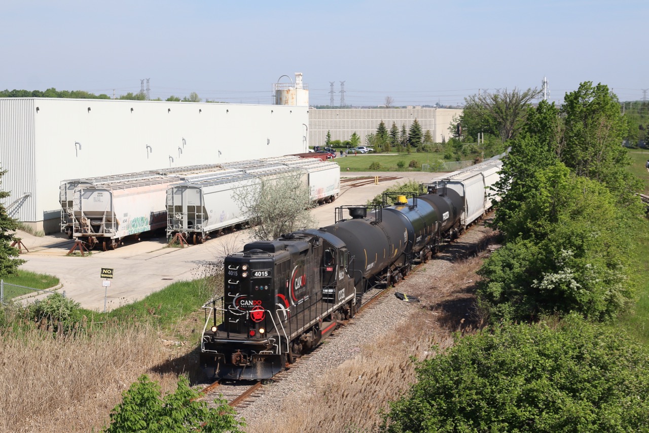 With the weeks quickly passing before Cando passes over the reigns of the OBRY to Trillium, there are a few shots along the line I still want to do justice. The shot here is off the side of Highway 401 near the old village of Meadowvale, just north of Streetsville. Unfortunately the warehouse on the short stub to the left stopped receiving rail service a couple years ago. The industry to the right though is still very active and is served by Canadian Pacific's train T14. Today the OBRY's southbound trip has several cars in tow as they head for the CP interchange in Streetsville where a number of cars await their northbound trip.