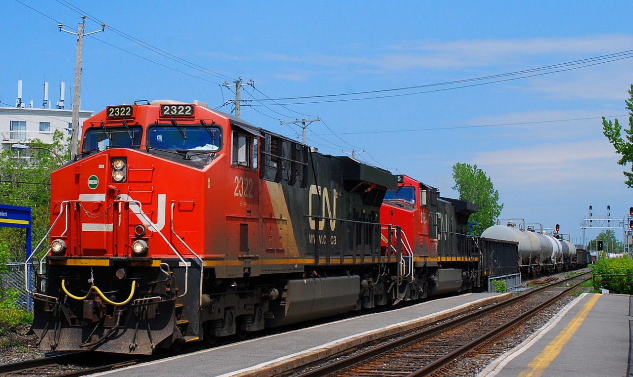 CN-2322 a ES-44-DC with CN-2585 a EF-644-c  pulling a convoy going direct to Toronto on CN-route X-321