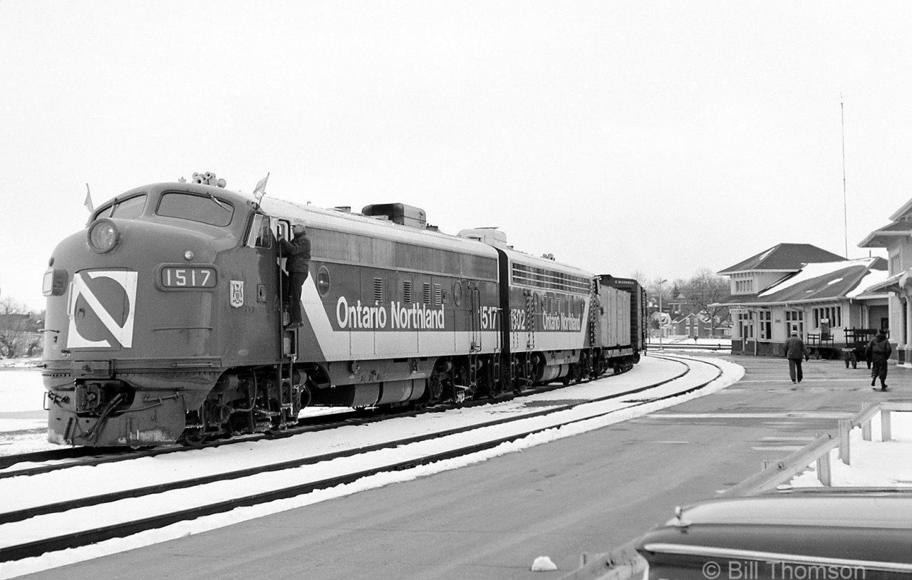 A pair of Ontario Northland F-units lead a northbound freight, stopped at CN's Barrie station on the Newmarket Sub in 1969. The power are back-to-back GMD FP7 units 1517 and 1502, both sporting the new "Progressive" green and white livery applied in 1966 (the third F-unit painted in this livery was 1521, but the units only lasted about six years in this scheme).