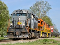 A rather late running 597 is seen passing through Cainsville with QGRY 6908, RLHH 3404, and RLHH 3049 leading 65 cars