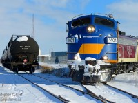One of the hallmarks of a shortline is personal service. Here we have OSR setting off propane cars into Dowler-Karn's facility in St. Thomas, opened in 2015 as joint venture with Factor Gas of Sarnia,  and itself a family run business. On one hand,  we have a railroad that believes in winning customers back to rail, large and small, and a family run company who matched with this belief to open a small terminal in St. Thomas capable of handling 7 cars at a time. During winter, when the propane is flowing I've heard this facility can get quite busy. This photo was taken <a href=http://www.railpictures.ca/?attachment_id=31831 target=_blank>after an epic battle with snow</a> and with motive power like this, the keepers just keep rolling in. Thanks, OSR!