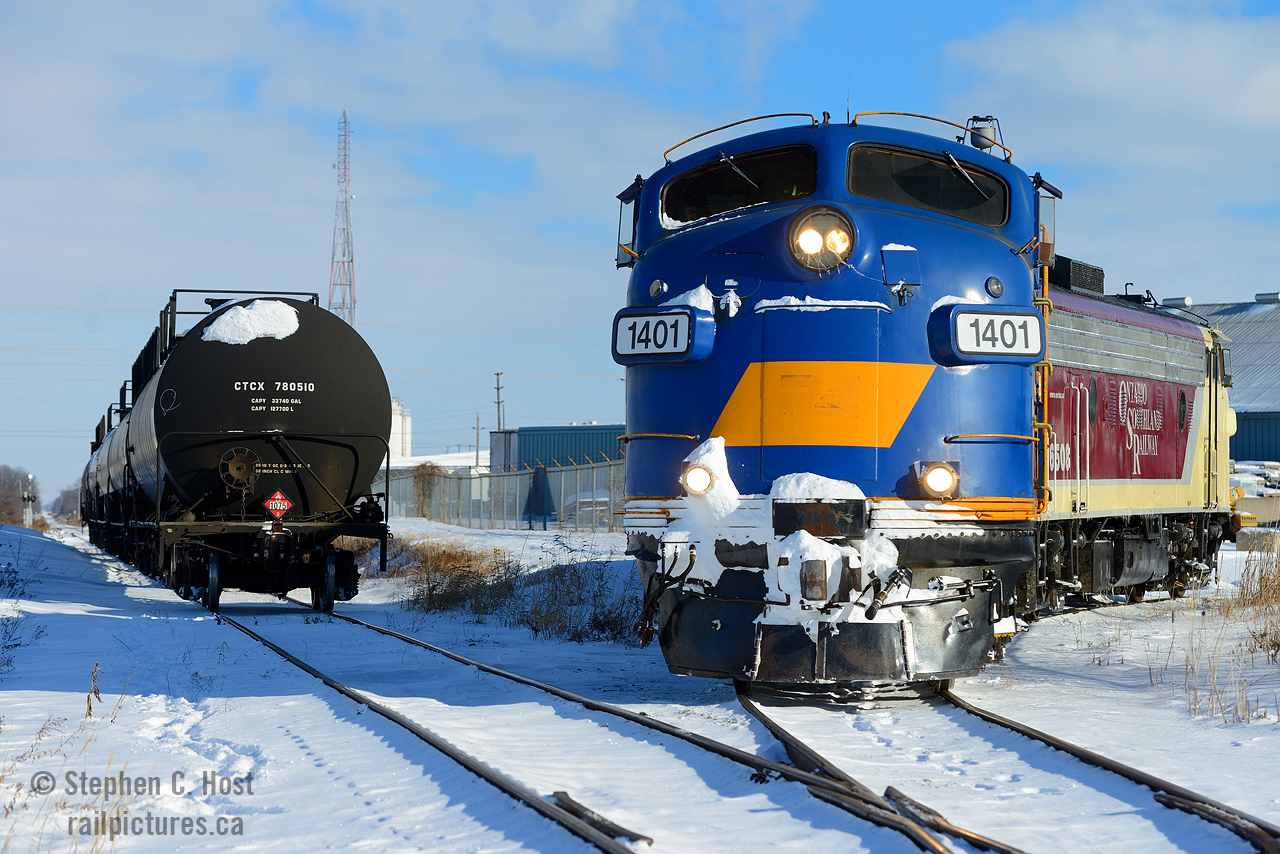 One of the hallmarks of a shortline is personal service. Here we have OSR setting off propane cars into Dowler-Karn's facility in St. Thomas, opened in 2015 as joint venture with Factor Gas of Sarnia,  and itself a family run business. On one hand,  we have a railroad that believes in winning customers back to rail, large and small, and a family run company who matched with this belief to open a small terminal in St. Thomas capable of handling 7 cars at a time. During winter, when the propane is flowing I've heard this facility can get quite busy. This photo was taken after an epic battle with snow and with motive power like this, the keepers just keep rolling in. Thanks, OSR!