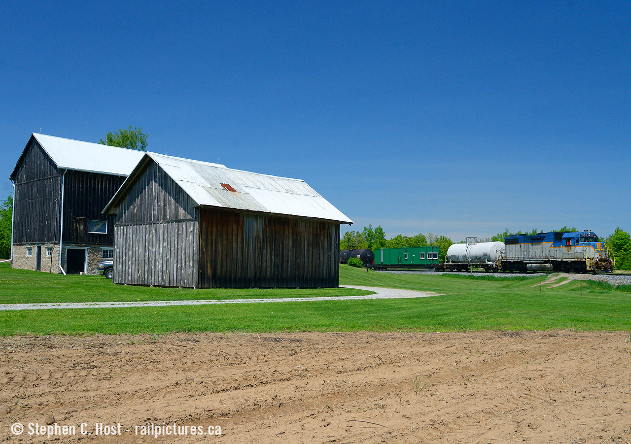 I'm standing on the property of a nice small farm near Carlisle where the owner gave us permission to take a photo from their property. This is the second time I've shot here and both times was the weed sprayer. I don't find the Hamilton subdivision to be all that scenic, but there are a few nice photos to be had, and this is definitely a nice spot. Only issue is it's a very small window of time to have good light here, but if you can get a southbound around 1-2 PM you'll be golden. Please ask for permission if you plan to shoot here :) It's an active farm.
