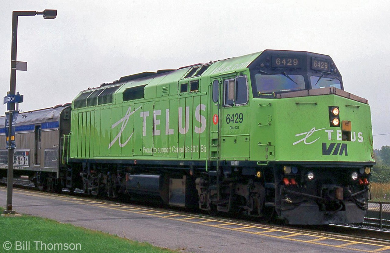 Telus-painted VIA F40PH-2 6429 is seen leading train #57, stopped at Kingston Station at 12:30pm in the afternoon. 6429, after wearing the yellow Home Hardware livery since the early 90's, was repainted green and lettered for Telus in 2002. It eventually lost its signature green livery in 2010 when it was rebuilt by CAD Rail with the rest of the F40 fleet.