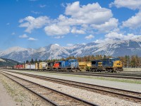 This is the current look of CN! Leased units everywhere! CEFX AC4400CW 1018 yards train L513 in Jasper's track #9 while the undercutter work train W904 sits in the clear in track #11 with GECX C40-8W 7315 on the point.