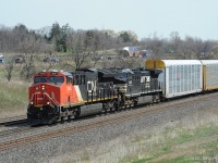 CN 3045 (ET44ac) and NS 4043 (AC44C6M) lead a CN mixed train (397?) downhill west on CN's Oakville Sub.  They are nearing MP 36 and have signals to proceed through CN Snake (Road) and CN Bayview (Junction). <br>
NS 4043 was remanufactured by NS at Roanoke VA in March 2017 from GE Dash 9-40C unit NS 8805, part of a large program by NS and GE continuing into 2018 and likely to be extended beyond.
Below cabside unit number 4043:  DC to AC \\\ AC44C6M   ( 3-phase AC waveform graphic in the middle )
